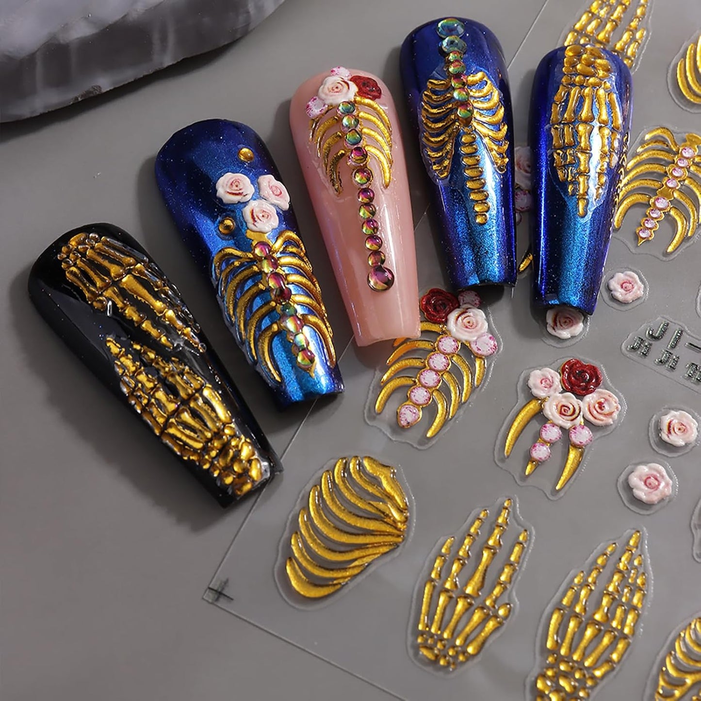 Halloween Nail Art Stickers Decals 5D Skeleton Hand Nail Decals 3PCS Embossed Self-Adhesive Spooky White Rose Gold Skull Design Gothic Holiday Nail Charms for Women DIY Manicure Accessories Supplies